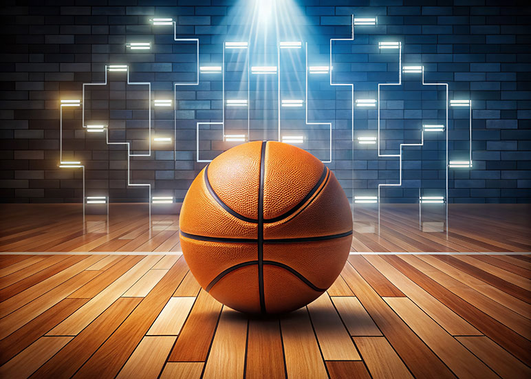 : Image of a basketball at rest sitting on a wooden basketball court floor with a tournament bracket behind the basketball.